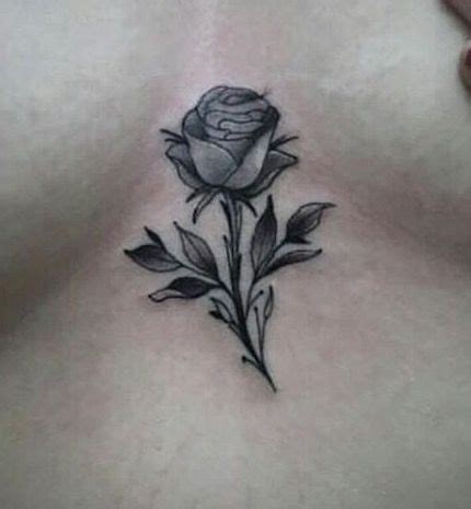 small rose tattoo between breast|Understanding The Meaning Of Rose Tattoo Between Breasts